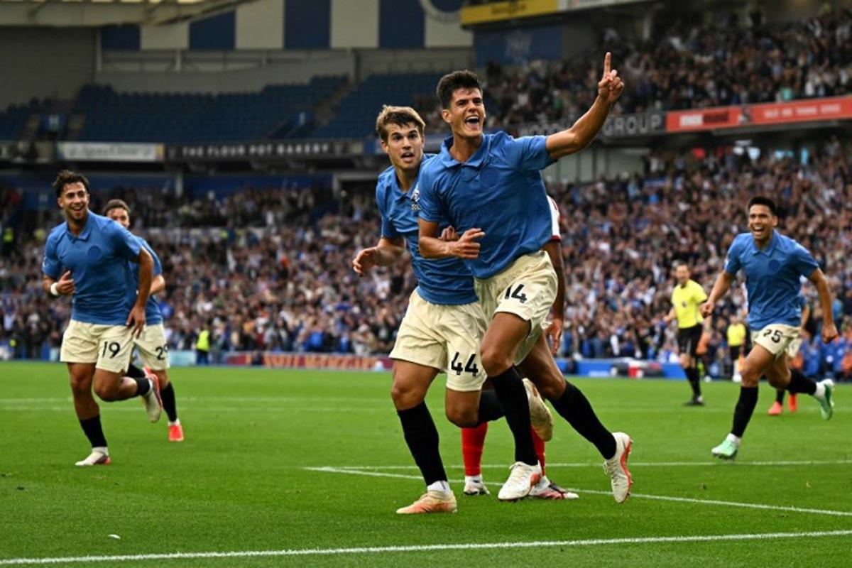 Brighton's Spanish midfielder #14 Chema Andrés celebrates scoring the team's third goal during the English Premier League football match between Brighton and Hove Albion and Arsenal at the American Express Community Stadium in Brighton, southern England on September 19, 2026. Glyn KIRK / AFP