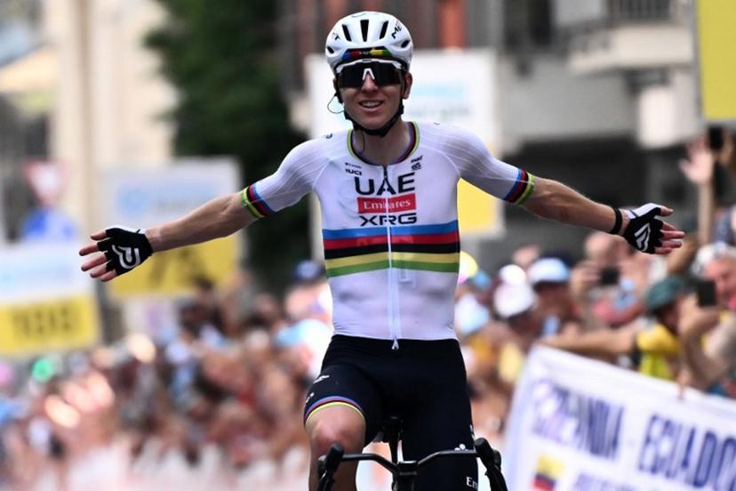 Slovenia's rider Tadej Pogacar of team UAE Emirates - XRG celebrates as he crosses the finish line to win the first stage of the Men's Tour of Switzerland (Tour de Suisse) cycling race, in Sondrio, Italy, on June 17, 2026. Marco BERTORELLO / AFP