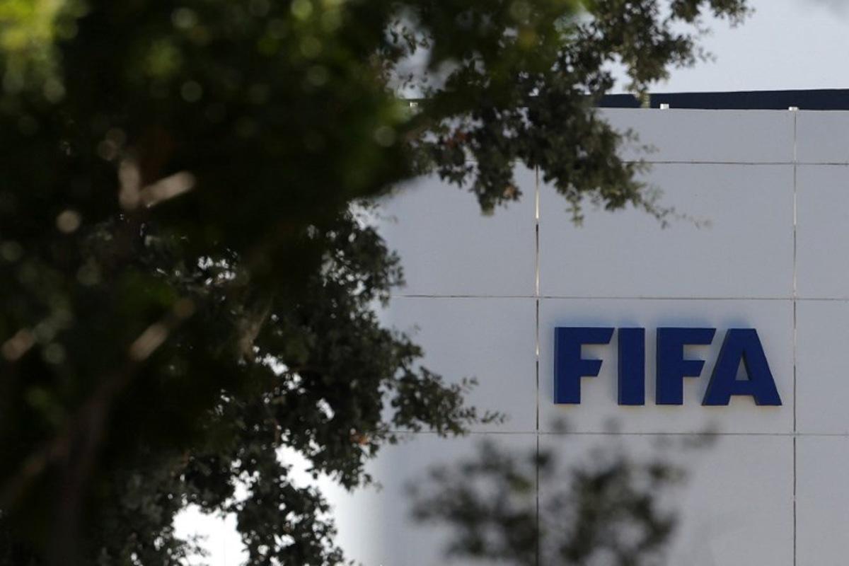 The FIFA logo is seen at its Africa regional office in Sale on August 5, 2026. President Gianni Infantino held emergency talks with other FIFA directors in Morocco on August 5, a source told AFP, amid a wave of criticism over his now shelved plan to open the World Cup to private investment. Abdelmajid BZIOUAT / AFP