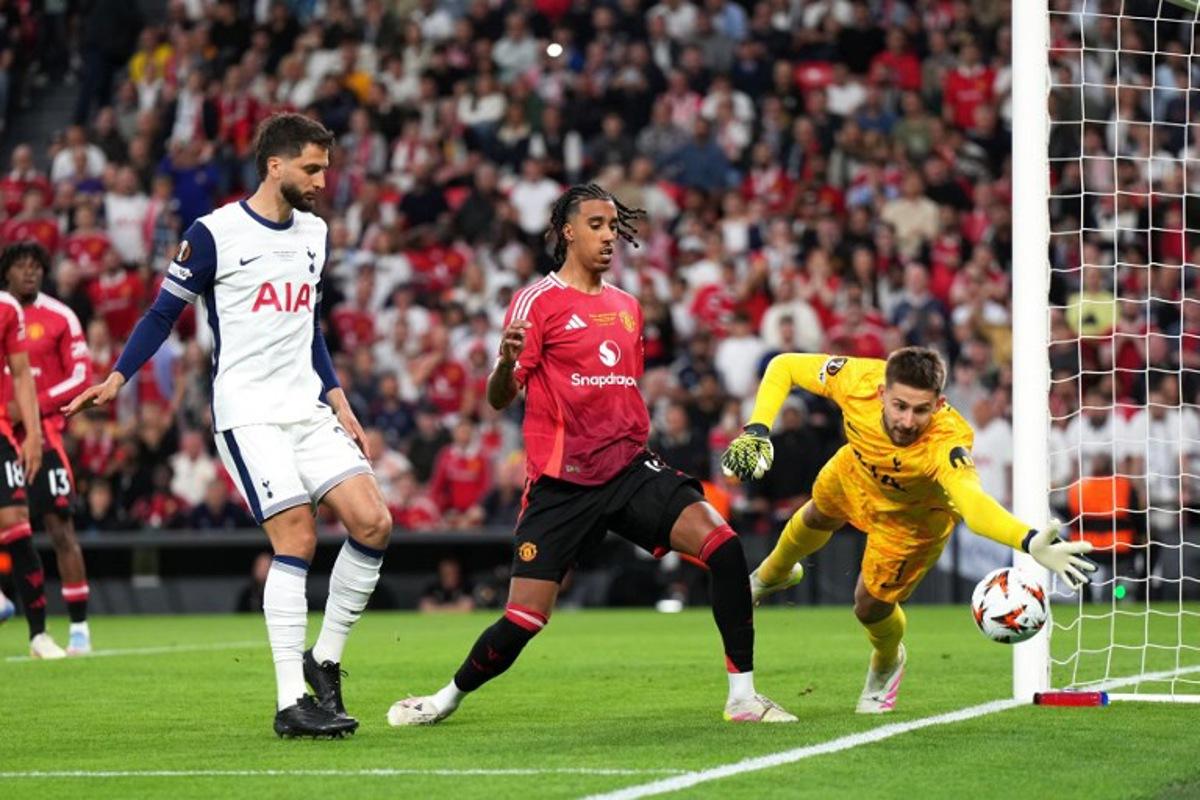 Tottenham Hotspur's Spanish defender #03 Sergio Reguilon, Manchester United's Danish defender #13 Patrick Dorgu and Tottenham Hotspur's Italian goalkeeper #01 Guglielmo Vicario vie for the ball during the UEFA Europa League final football match between Tottenham Hotspur and Manchester United at San Mames stadium in Bilbao on May 21, 2025. Cesar Manso / AFP
