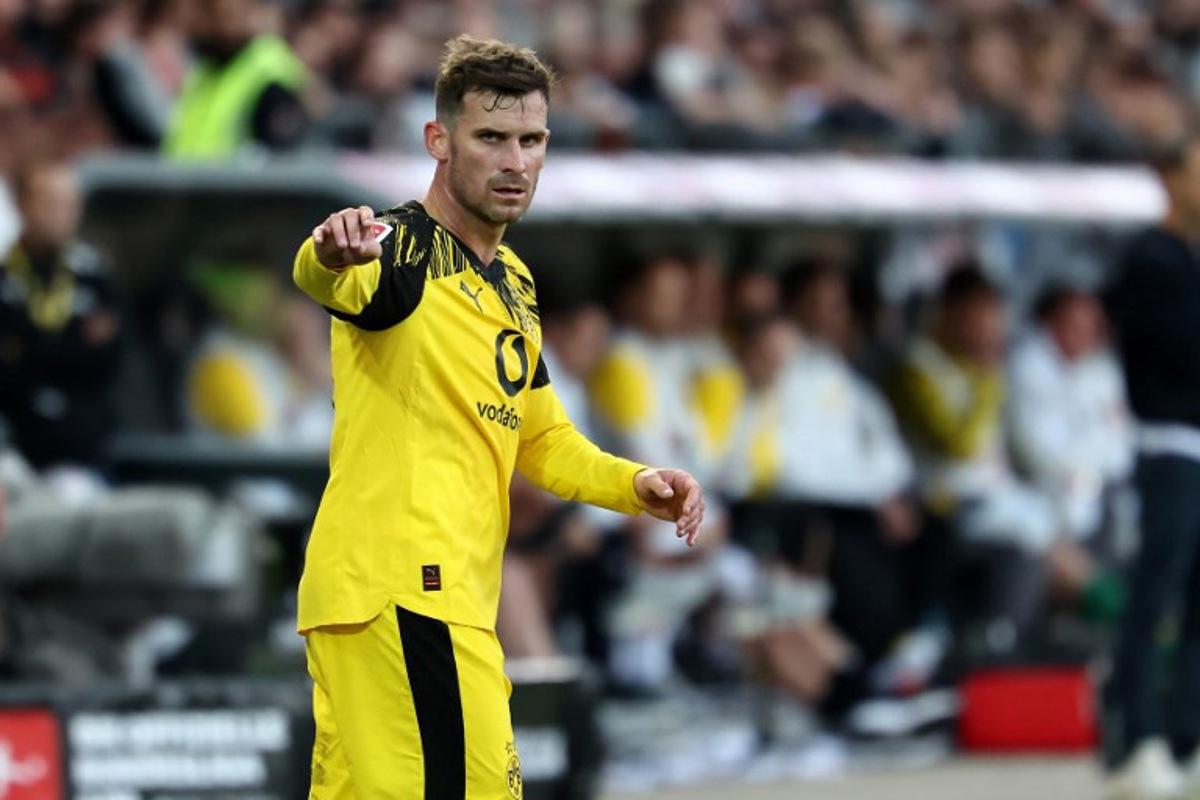 Dortmund's German midfielder #13 Pascal Gross gestures during the German first division Bundesliga football match between FC St Pauli and Borussia Dortmund in Hamburg, northern Germany on August 23, 2025. IBRAHIM OT / AFP