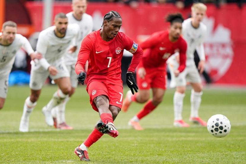 Canada's forward #07 Jonathan David takes a penalty kick and scores a goal during a friendly football match between Canada and Iceland at BMO Field in Toronto, Canada, on March 28, 2026. Geoff Robins / AFP