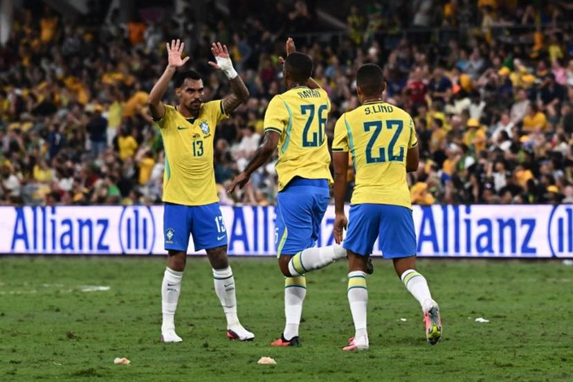 Brazil's Rayan Vitor Simplício Rocha (C) celebrates with Brazil's Matheuzinho (L) after scoring a goal during the International friendly football match between Australia and Brazil at Queensland Country Bank Stadium in Townsville on September 25, 2026. SAEED KHAN / AFP
