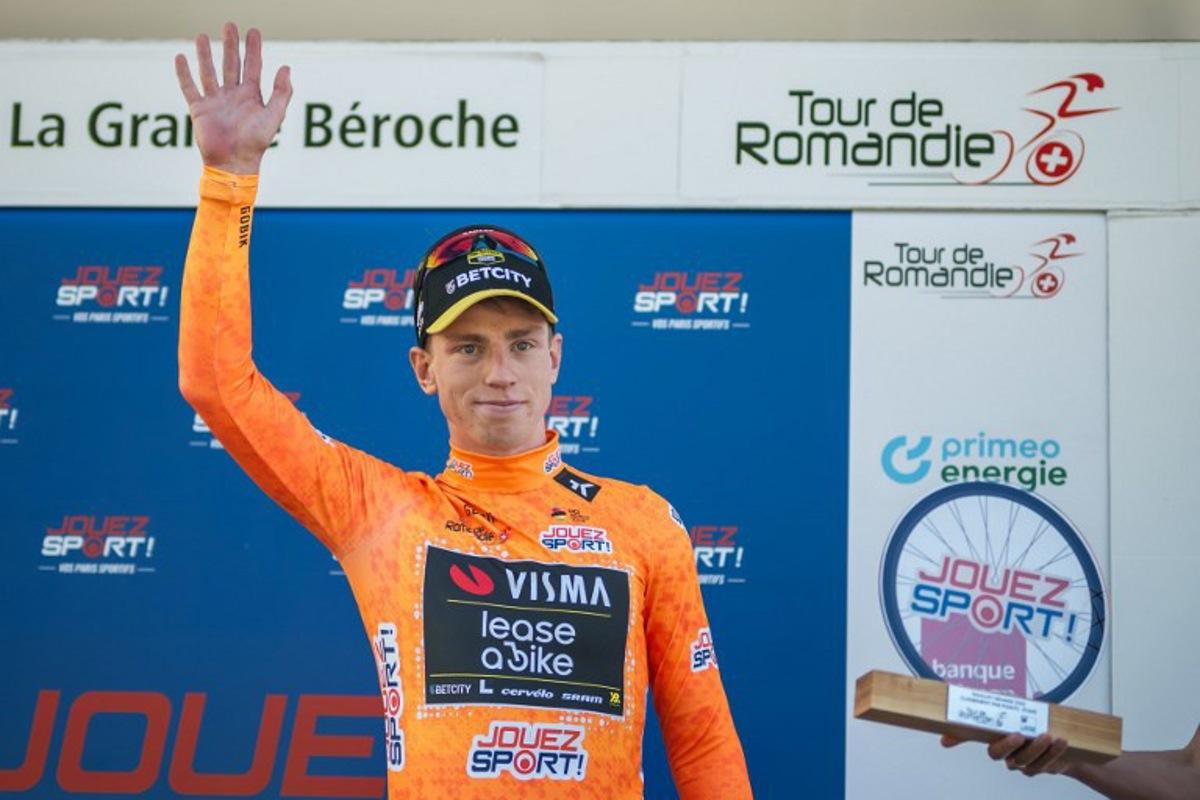 Great Britain's Matthew Brennan wearing the sprint jersey reacts during the podium ceremony of the second stage of the Tour of Romandie UCI cycling World tour, 157km loop from the start to the finish in La Grande Beroche, in Saint-Aubin-Sauges on May 1, 2025. Fabrice COFFRINI / AFP