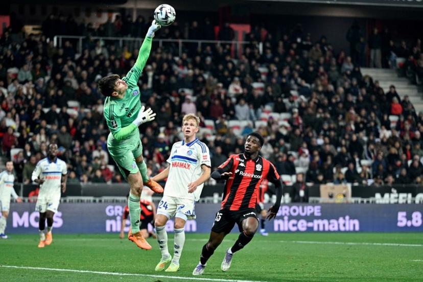 Strasbourg's goalkeeper #39 Mike Penders (2L) stretches for the ball to make a save during the French L1 football match between OGC Nice and RC Strasbourg Alsace at the Allianz Riviera Stadium in Nice, south-eastern France, on January 3, 2026. Frederic DIDES / AFP