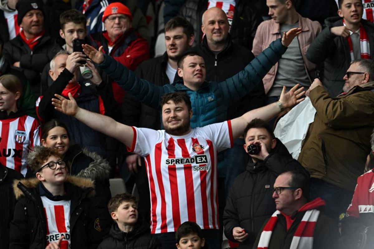 Sunderland fans build the atmosphere in the crowd ahead of the English FA Cup third round football match between Sunderland and Newcastle United at The Stadium of Light in Sunderland in north east England on January 6, 2024. Paul ELLIS / AFP