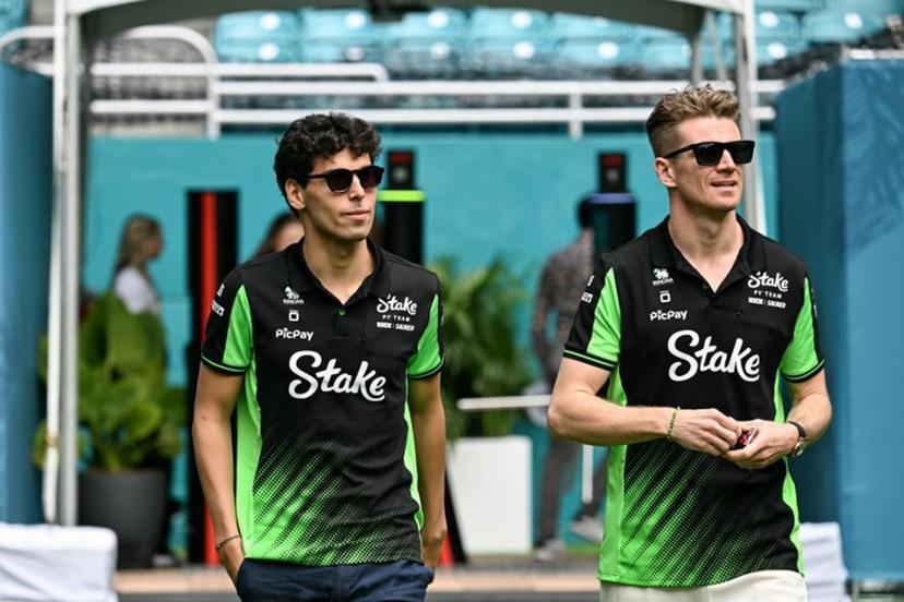(L-R) Kick Sauber's Brazilian reserve driver Gabriel Bortoleto and Kick Sauber's German driver Nico Hulkenberg arrive ahead of practice session for the 2025 Miami Formula One Grand Prix at Miami International Autodrome in Miami Gardens, Florida, on May 2, 2025. Chandan Khanna / AFP