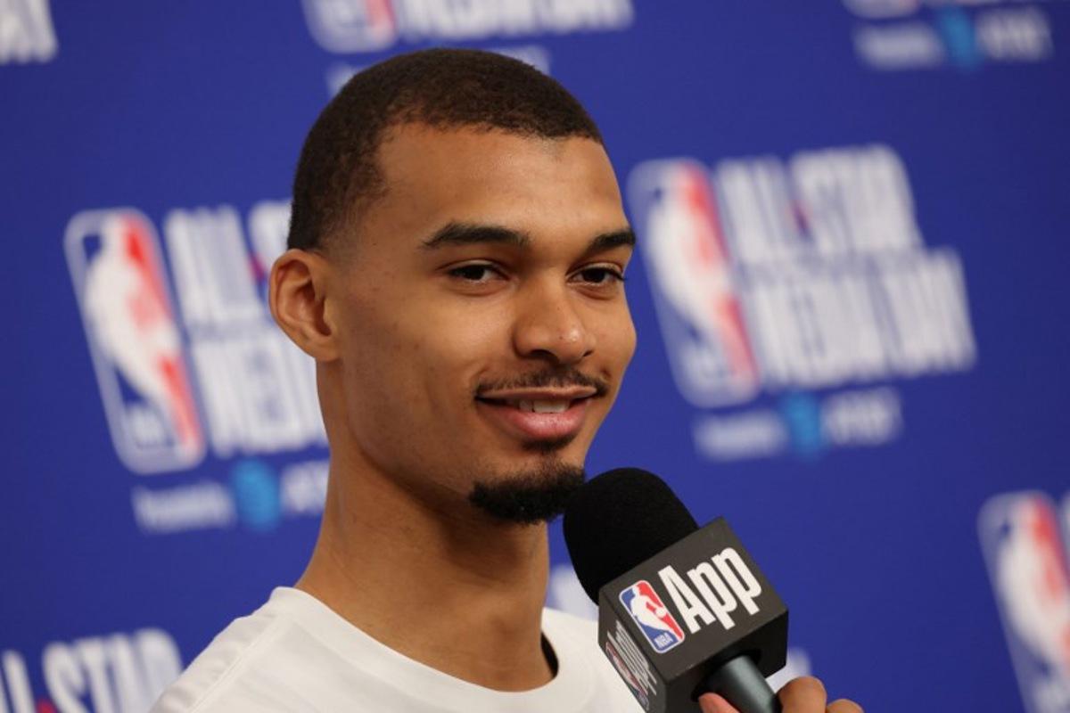 French basketball player Victor Wembanyama of the San Antonio Spurs speaks to the media during the NBA All-Star media day at the Intuit Dome in Inglewood, California, on February 14, 2026. Patrick T. Fallon / AFP