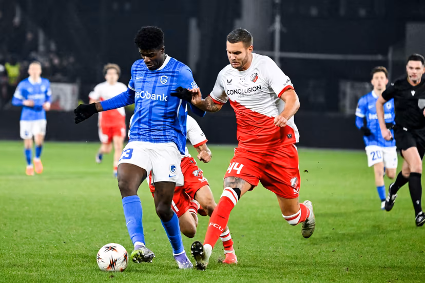 Genk's Bibout Banind and Utrecht's Mike Eerdhuijzen pictured in action during a soccer game between Dutch soccer club FC Utrecht and Belgian KRC Genk, on Thursday 22 January 2026 in Utrecht, Netherlands, the seventh game (out of 8) in the league phase of the UEFA Europa League competition. BELGA PHOTO TOM GOYVAERTS
