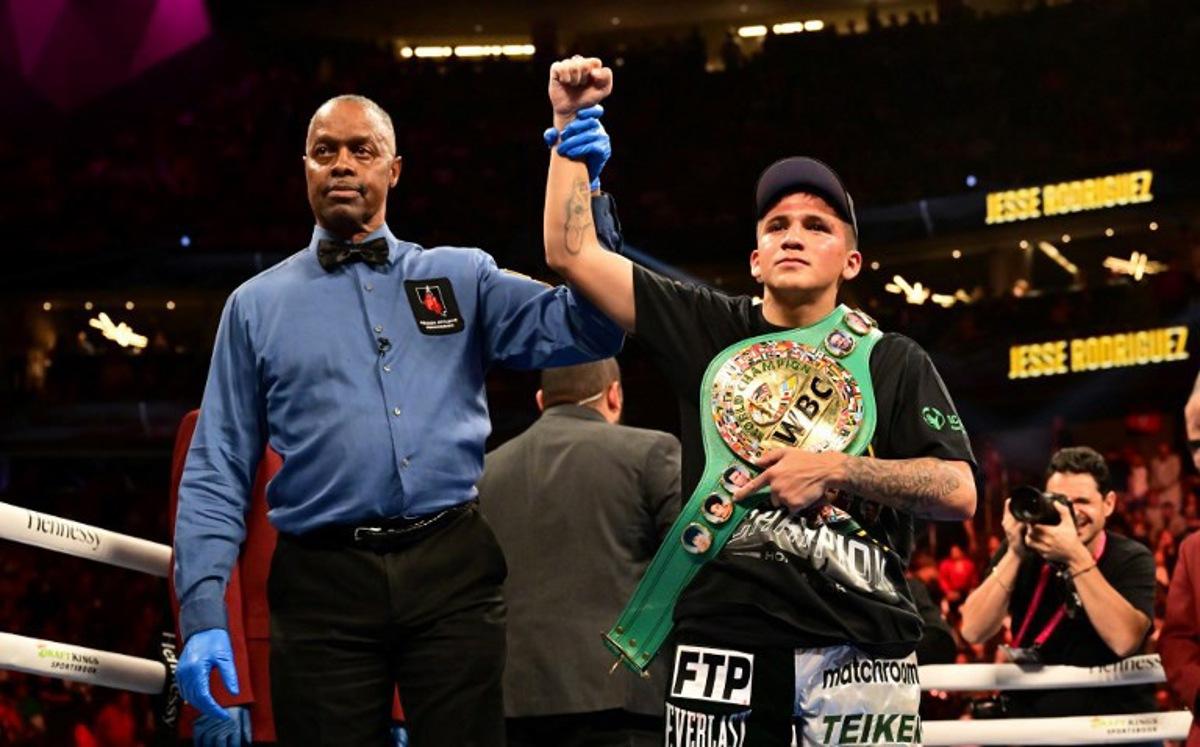 US boxer Jesse Rodriguez celebrates with his belt after defeating Mexican boxer Israel Gonzalez during their World Boxing Council (WBC) super flyweight title bout at the T-Mobile Arena in Las Vegas, Nevada, September 17, 2022. Frederic J. BROWN / AFP