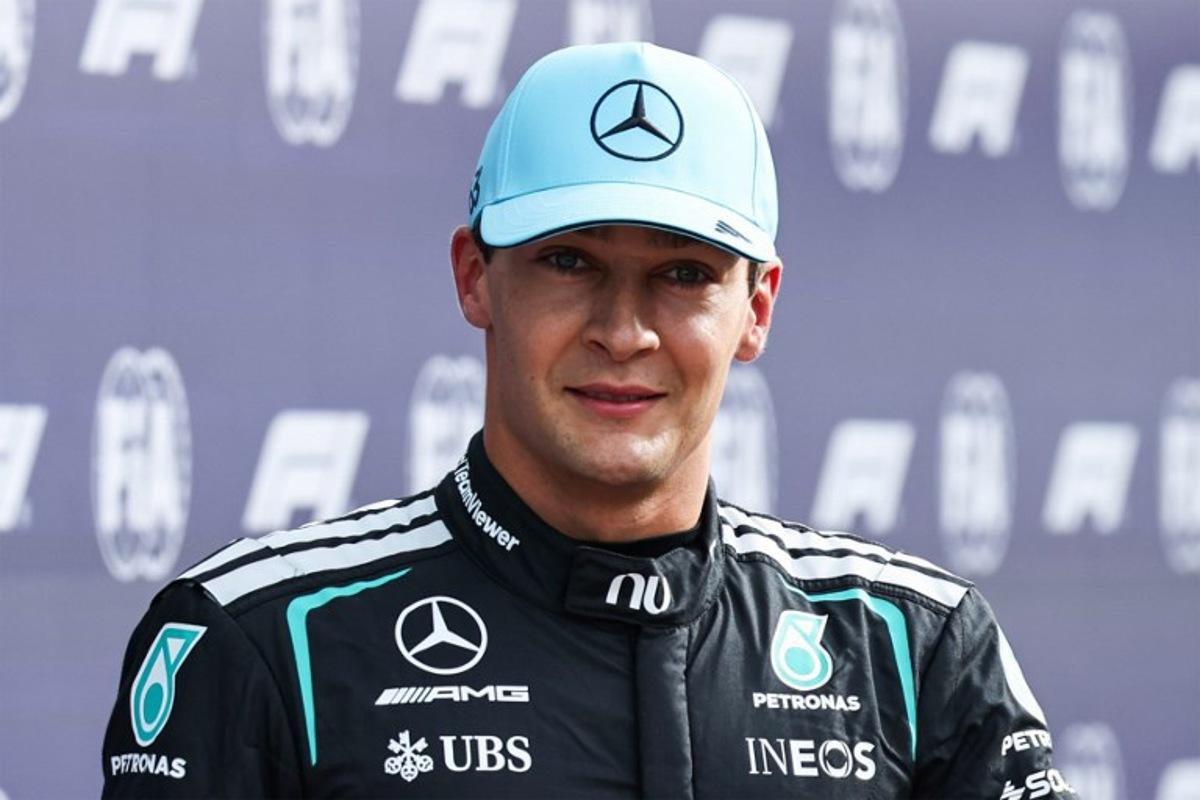 Mercedes' British driver George Russell celebrates his pole position after the sprint qualifying session of the Formula One Dutch Grand Prix at The Circuit Zandvoort, western Netherlands, on August 21, 2026. SIMON WOHLFAHRT / AFP