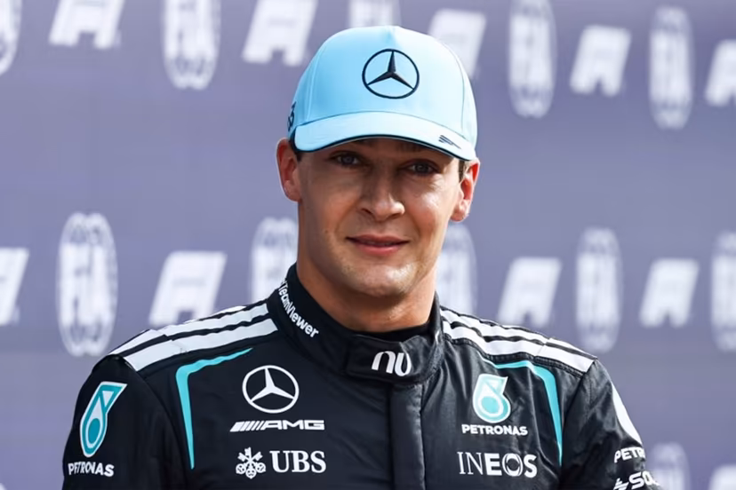Mercedes' British driver George Russell celebrates his pole position after the sprint qualifying session of the Formula One Dutch Grand Prix at The Circuit Zandvoort, western Netherlands, on August 21, 2026. SIMON WOHLFAHRT / AFP
