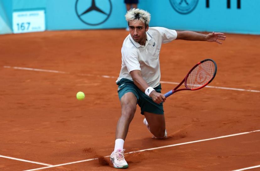 Spain's Daniel Merida returns the ball to France's Corentin Moutet during their 2026 ATP Tour Madrid Open tennis tournament third round singles match at the Caja Magica in Madrid, on April 25, 2026. Thomas COEX / AFP