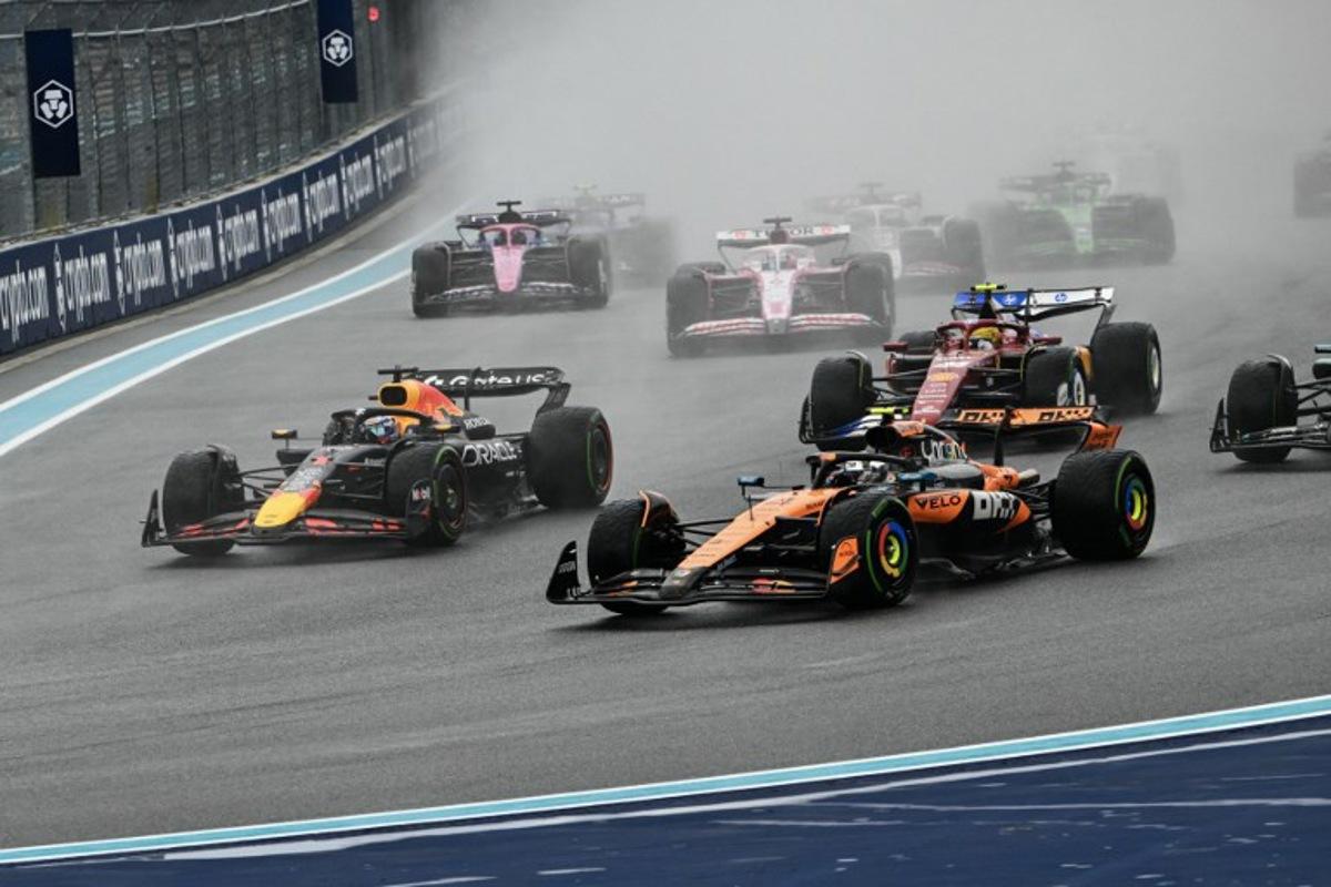 (L-R) Red Bull Racing's Dutch driver Max Verstappen and McLaren's British driver Lando Norris race during the 2025 Miami Formula One Sprint at Miami International Autodrome in Miami Gardens, Florida, on May 3, 2025. Chandan Khanna / AFP