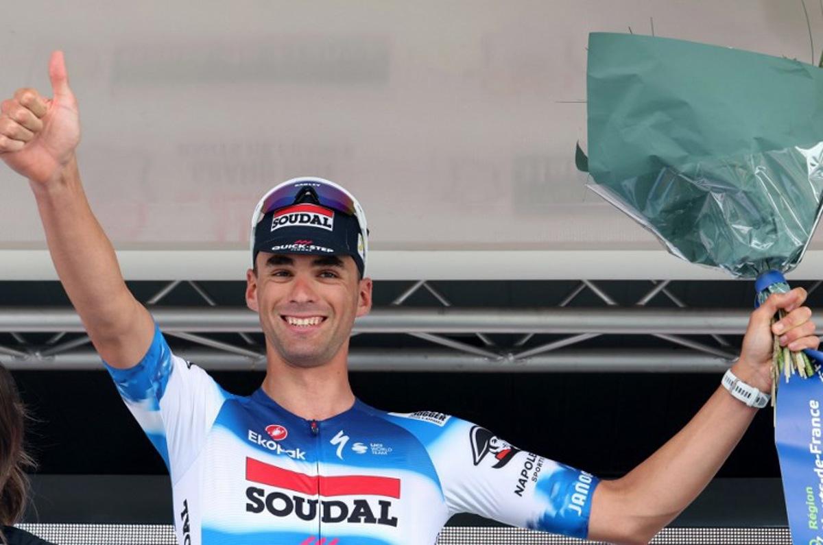 Soudal-Quick Step's Belgian rider Warre Vangheluwe, celebrates on the podium after winning the fourth stage of the "4 jours de Dunkerque" (Four days of Dunkirk) cycling race, 171,3 km from Mazingarbe to Pont-a-Marcq, in north France, on May 17, 2024. FRANCOIS LO PRESTI / AFP