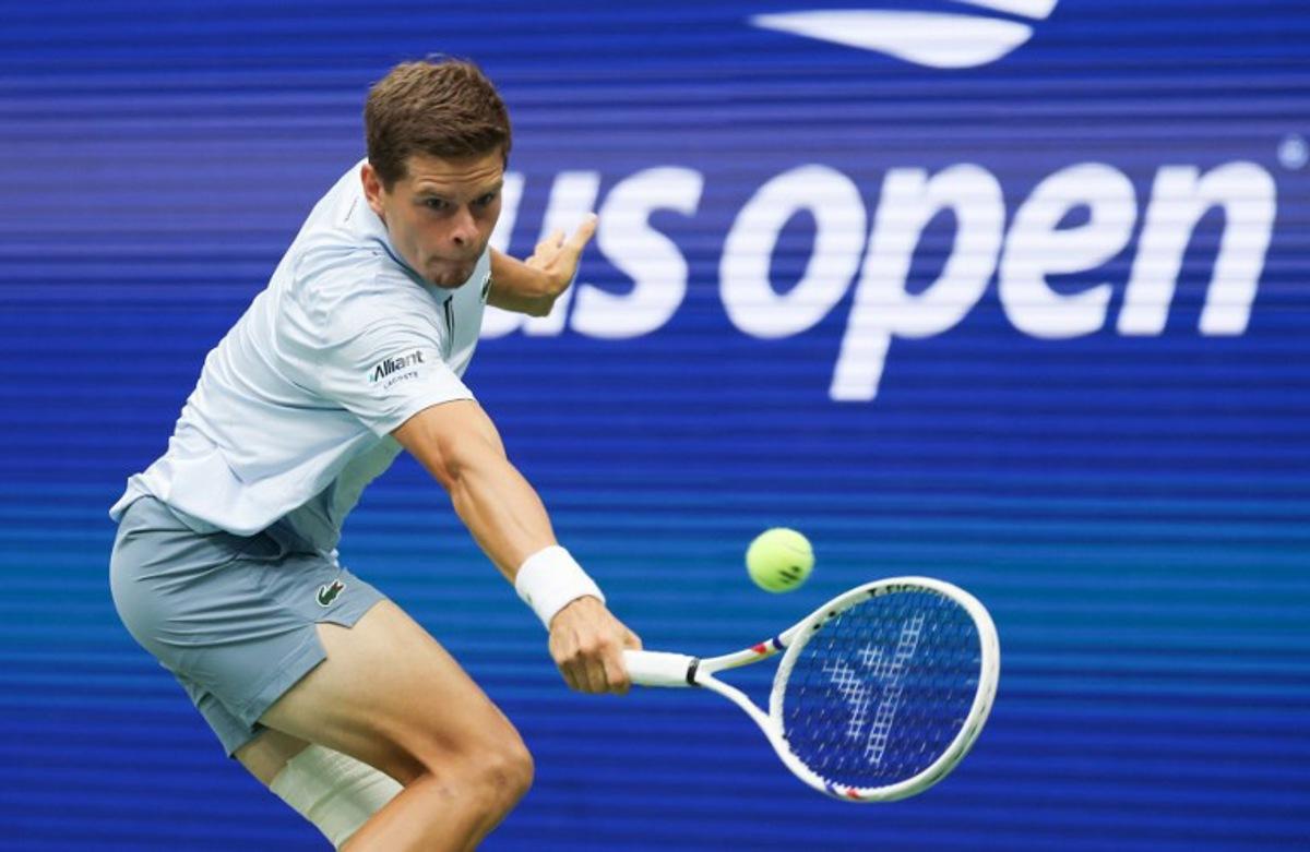 Belgium's Alexander Blockx returns the ball to Russia's Karen Khachanov during the men's singles quarter-final tennis match on day eleven of the US Open tennis tournament at the USTA Billie Jean King National Tennis Center in New York City on September 9, 2026. TIMOTHY A. CLARY / AFP