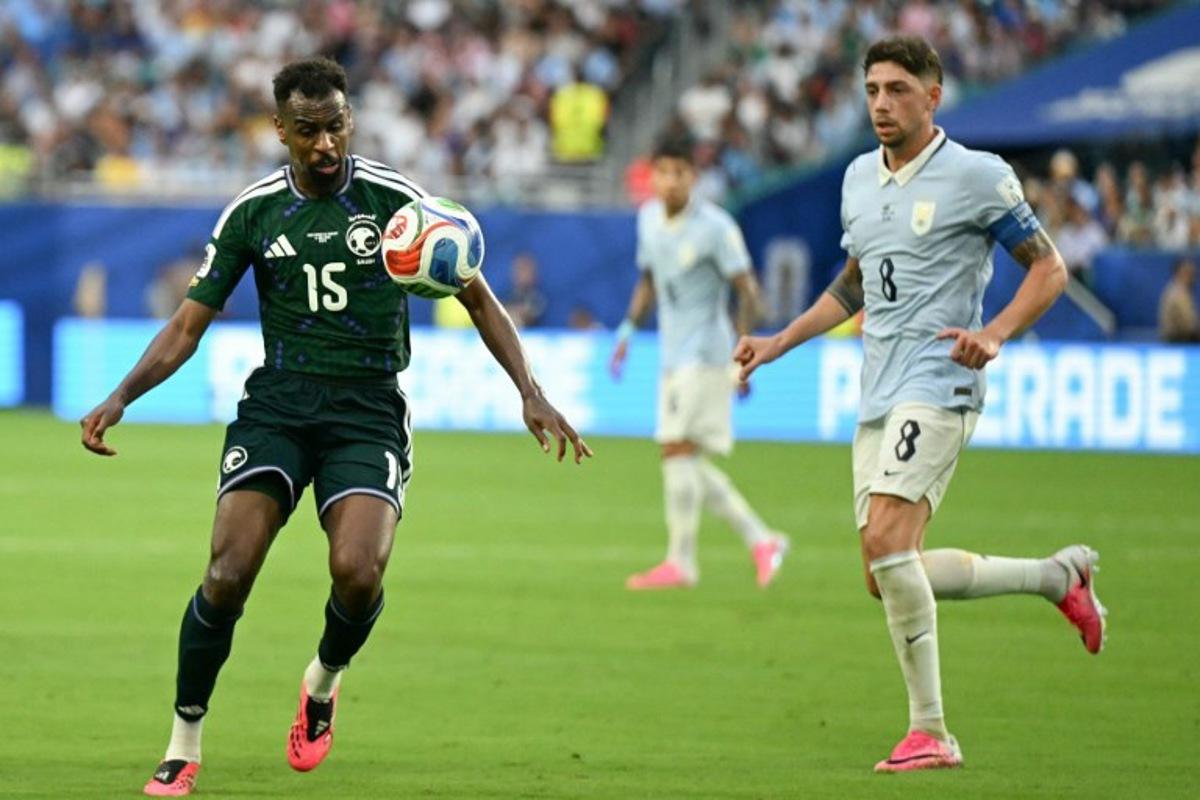 Saudi Arabia's midfielder #15 Abdullah Al-Khaibari and Uruguay's midfielder #08 Federico Valverde fight for the ball during the 2026 World Cup Group H football match between Saudi Arabia and Uruguay at the Miami Stadium in Miami Gardens on June 15, 2026. CHANDAN KHANNA / AFP
