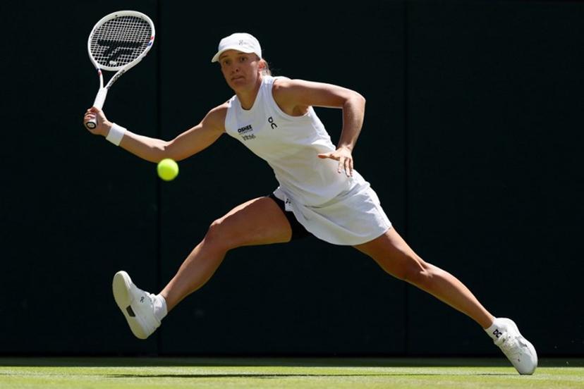 Poland's Iga Swiatek returns against Czech Republic's Karolina Pliskova during their women's singles second round tennis match on the fourth day of the 2026 Wimbledon Championships at The All England Lawn Tennis and Croquet Club in Wimbledon, southwest London, on July 2, 2026. Adrian Dennis / AFP
