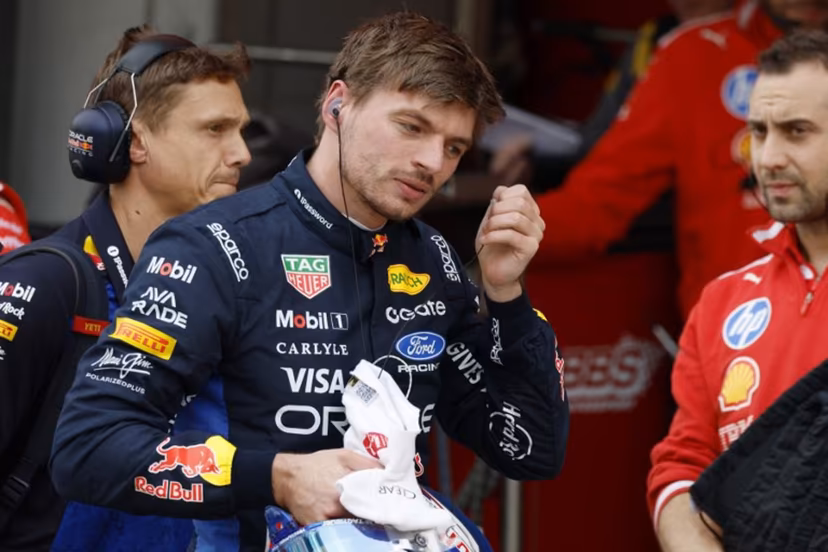 Red Bull Racing's Dutch driver Max Verstappen takes off his earpiece in the pits during the qualifying session ahead of the Formula One Japanese Grand Prix at the Suzuka circuit in Suzuka, Mie prefecture on March 28, 2026. FRANCK ROBICHON / POOL / AFP