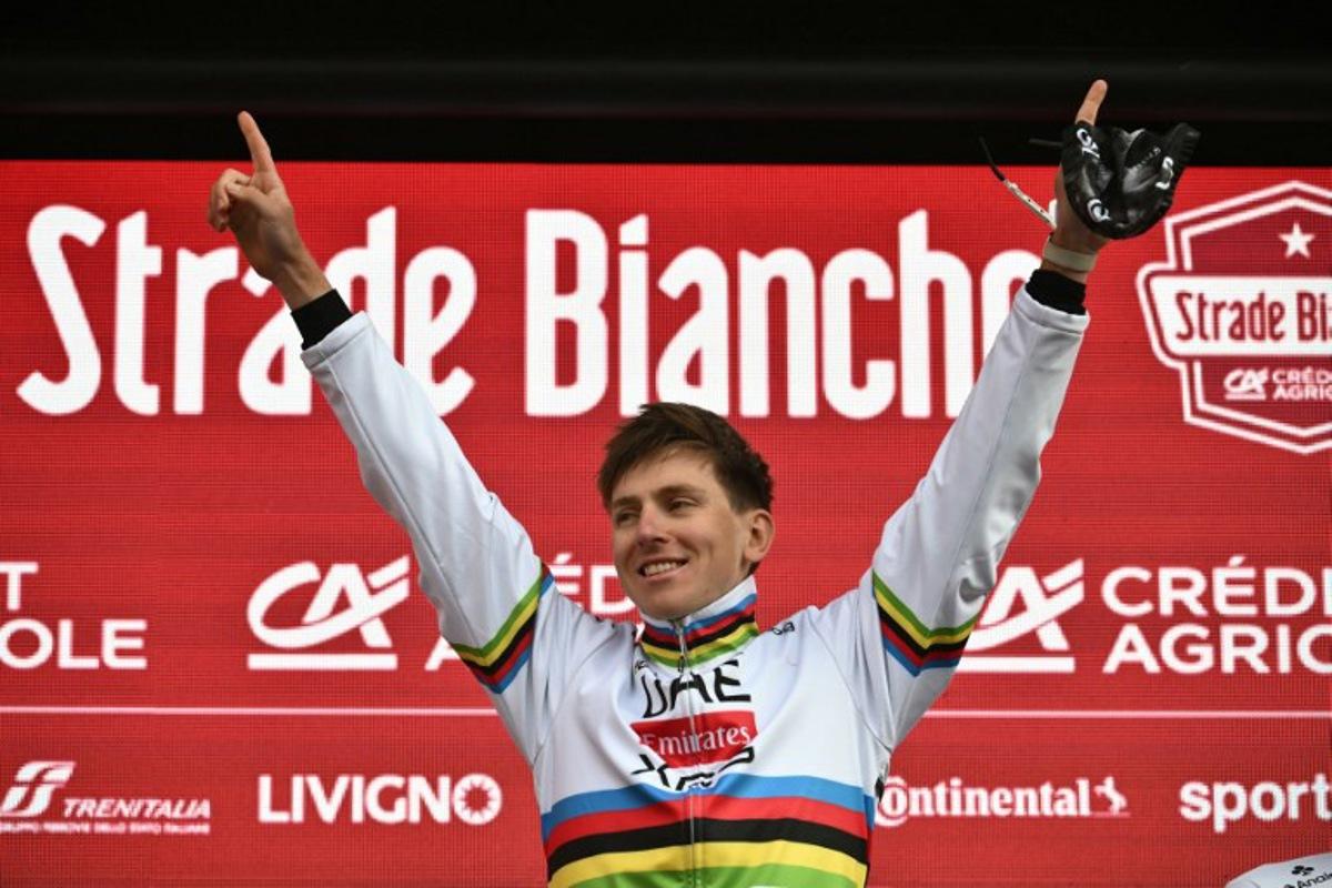 Team UAE's Slovenain rider Tadej Pogacar celebrates on the podium after winning the 19th one-day classic 'Strade Bianche' (White Roads) men's cycling race between Siena and Siena in Tuscany on March 8, 2025. Marco BERTORELLO / AFP