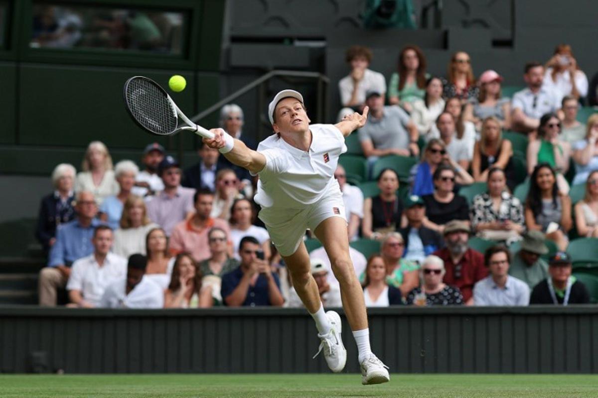 Italy's Jannik Sinner plays a forehand return to Australia's Aleksander Vukic during their men's singles second round tennis match on the fourth day of the 2025 Wimbledon Championships at The All England Lawn Tennis and Croquet Club in Wimbledon, southwest London, on July 3, 2025. Adrian Dennis / AFP