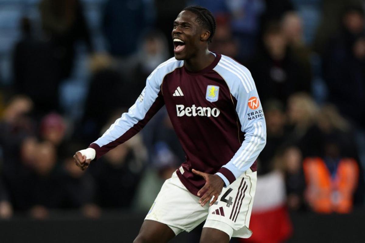 Aston Villa's Belgian midfielder #24 Amadou Onana celebrates at the final whistle in the English Premier League football match between Aston Villa and Wolverhampton Wanderers at Villa Park in Birmingham, central England on November 30, 2025. Aston Villa won the match 1-0. Darren Staples / AFP