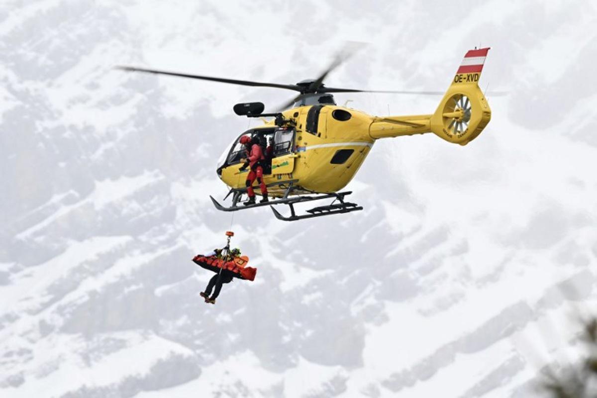 Norway's Fredrik Moeller is airlifted off the slope after crashing in the first official training for the men's downhill alpine skiing event ahead of the Milano Cortina 2026 Winter Olympic Games at the Stelvio Ski Centre in Bormio (Valtellina) on February 4, 2026. Fabrice COFFRINI / AFP