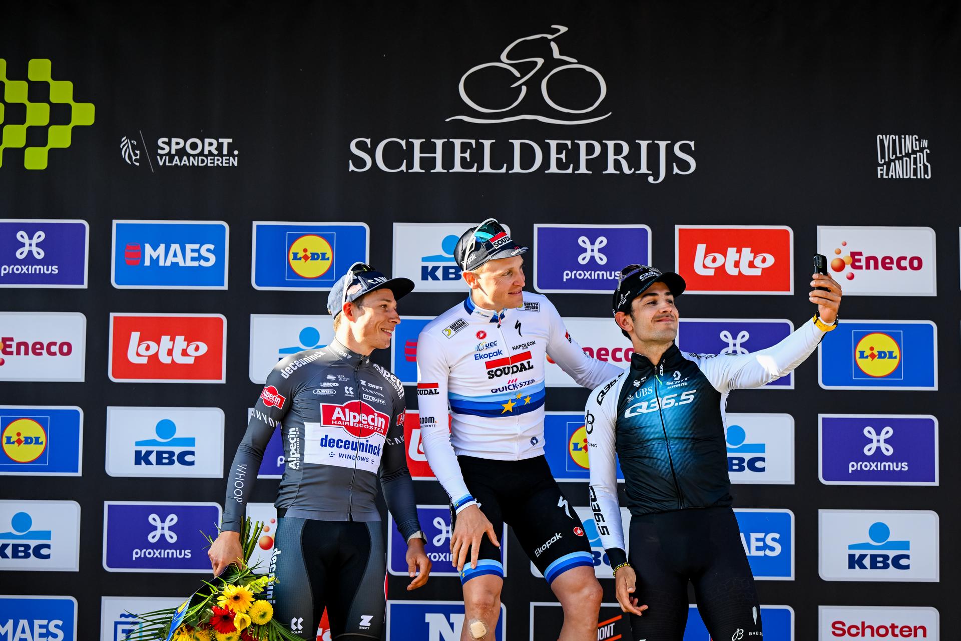 Belgian Jasper Philipsen of Alpecin-Deceuninck, Belgian Tim Merlier of Soudal Quick-Step and Italian Matteo Moschetti of Q36.5 Pro Cycling Team pictured on the podium after the men's race of the 113th edition of the 'Scheldeprijs' one day cycling event, 202,8 km from Terneuzen, the Netherlands to Schoten, Belgium on Wednesday 09 April 2025. BELGA PHOTO TOM GOYVAERTS