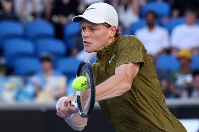 Italy's Jannik Sinner hits a shot against Italy's Luciano Darderi during their men's singles match on day nine of the Australian Open tennis tournament in Melbourne on January 26, 2026. DAVID GRAY / AFP