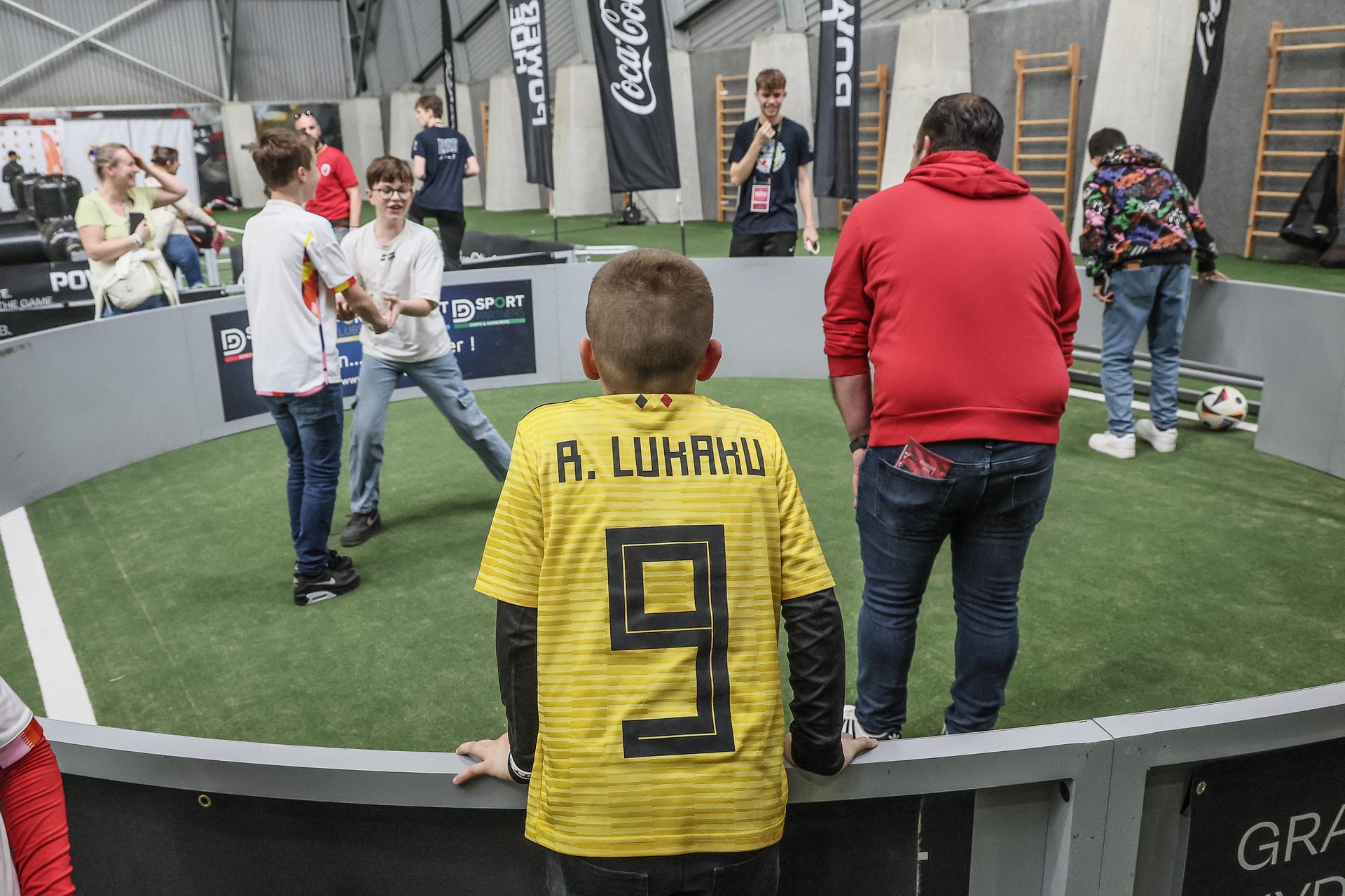 Children attend the fanday of the Belgian national soccer team Red Devils, at the Royal Belgian Football Association's training center, in Tubize, Wednesday 20 March 2024. Some 1500 fans are invited to the Proximus Basecamp to attend a training session and enjoy several other activities. On Saturday, the Red Devils play a friendly game against Ireland, part of the preparations for the Euro 2024. BELGA PHOTO BRUNO FAHY