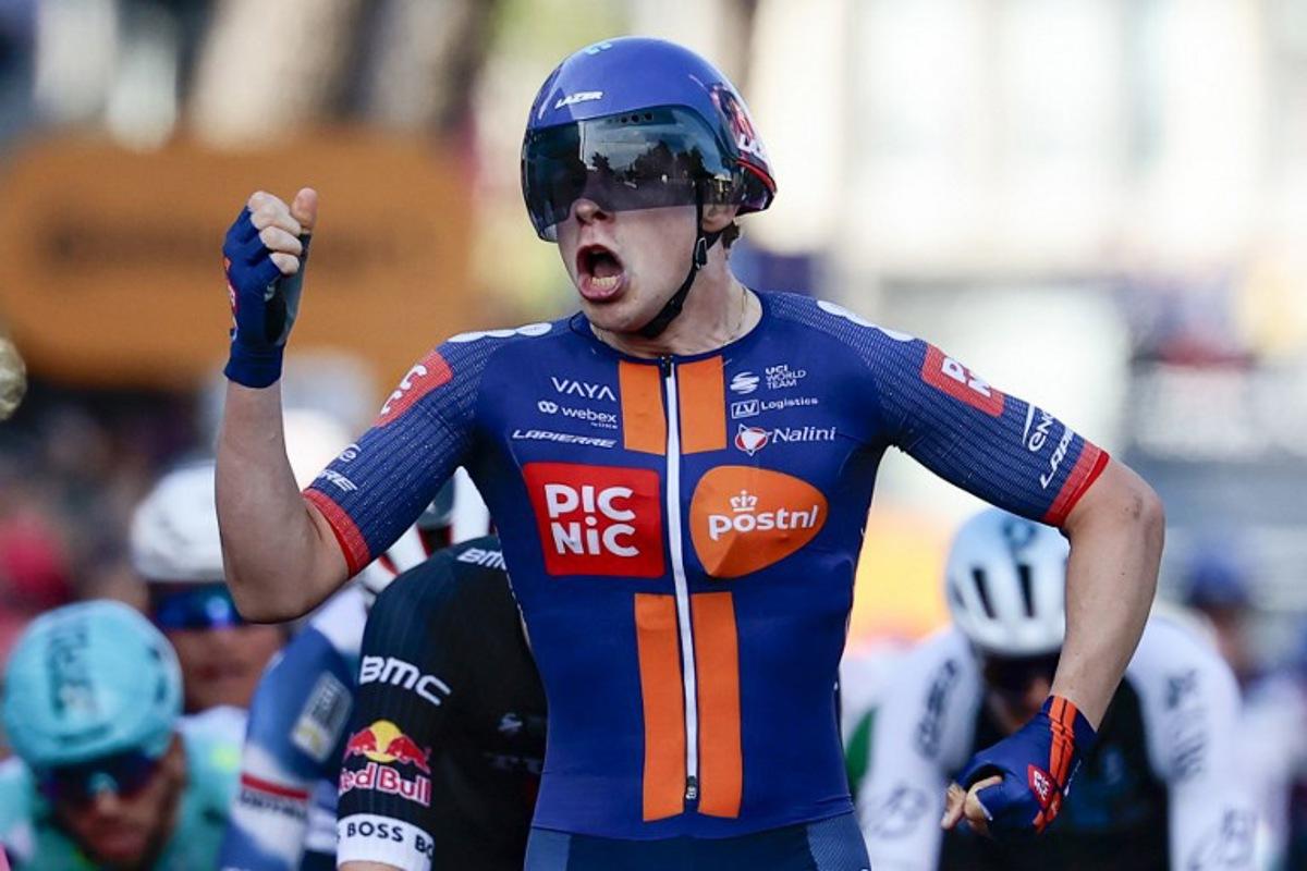 Team Picnic PostNL's Dutch rider Casper Van Uden celebrates as he crosses the finish line of the 4th stage of the 108th Giro d'Italia cycling race 189kms from Alberobello to Lecce on May 13, 2025 Luca Bettini / AFP