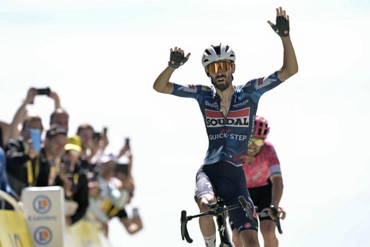 Soudal Quick-Step team's French rider Valentin Paret-Peintre cycles to the finish line to win the 16th stage of the 112th edition of the Tour de France cycling race, 171.5 km between Montpellier and Mont Ventoux, southern France, on July 22, 2025. Loic VENANCE / AFP