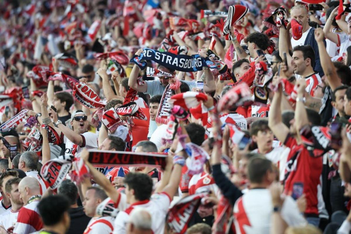Supporters wave banners before the start of the UEFA Conference League semi final first leg football match between Rayo Vallecano de Madrid and RC Strasbourg Alsace at Vallecas Stadium in Madrid on April 30, 2026. Pierre-Philippe MARCOU / AFP