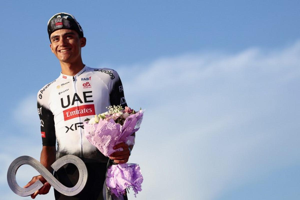 Second placed UAE Team Emirates XRG's Mexican rider Isaac Del Toro celebrates on the podium at the end of the 21st and last stage of the 108th Giro d'Italia cycling race of 143kms from Rome to Rome on June 1, 2025. Luca Bettini / AFP
