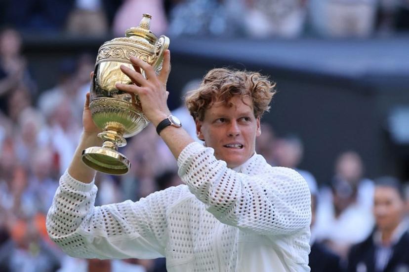 Italy's Jannik Sinner poses with the Gentleman's Singles trophy after his victory against Germany's Alexander Zverev at the end of their men's singles final tennis match on the last day of the 2026 Wimbledon Championships at The All England Lawn Tennis and Croquet Club in Wimbledon, southwest London, on July 12, 2026. Henry NICHOLLS / AFP