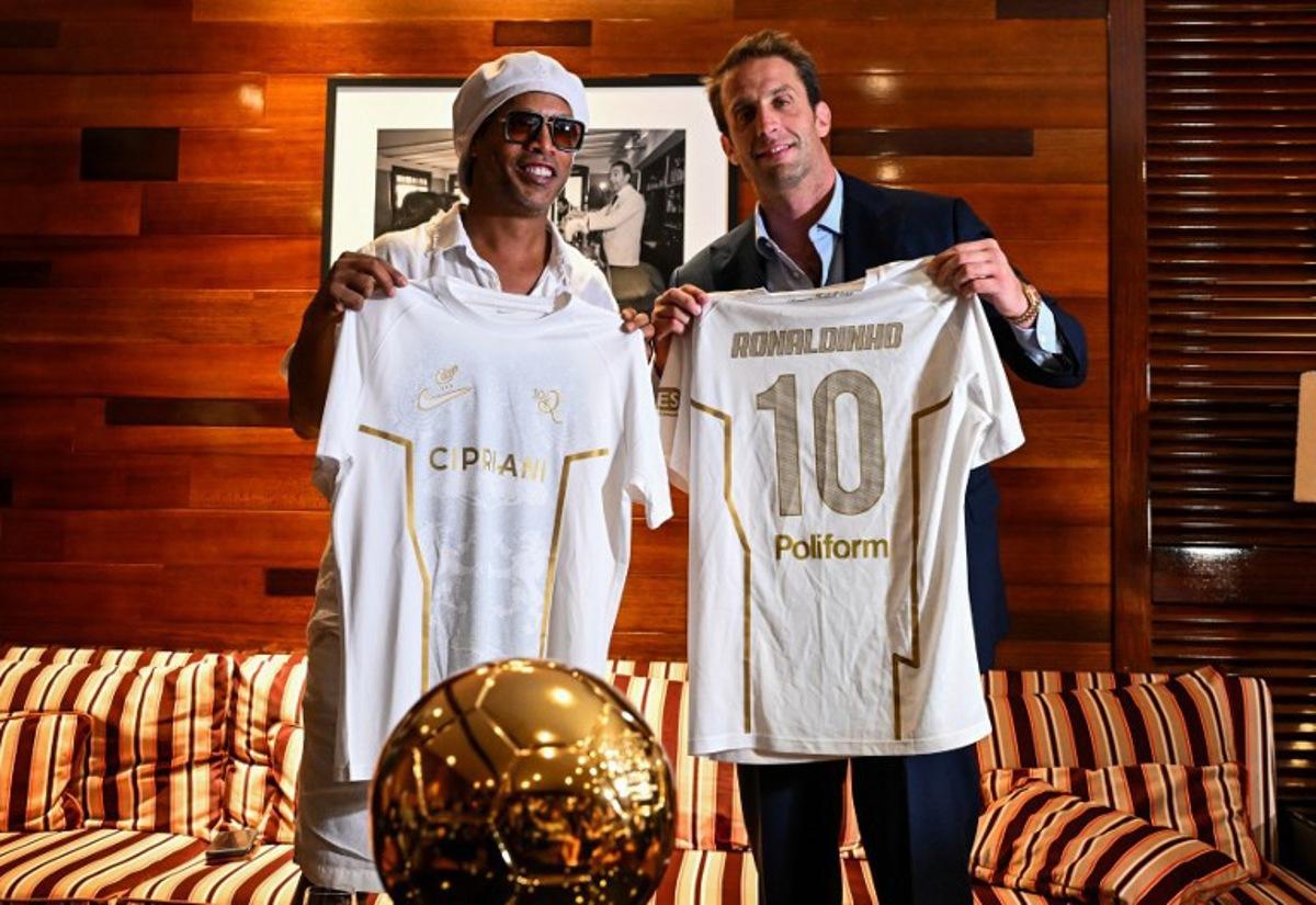 Brazilian football legend Ronaldinho poses with Ravenna FC president Ignazio Cipriani during an event marking his presentation as ambassador and strategic partner of the Italian club in Miami, Florida, on June 23, 2026. CHANDAN KHANNA / AFP