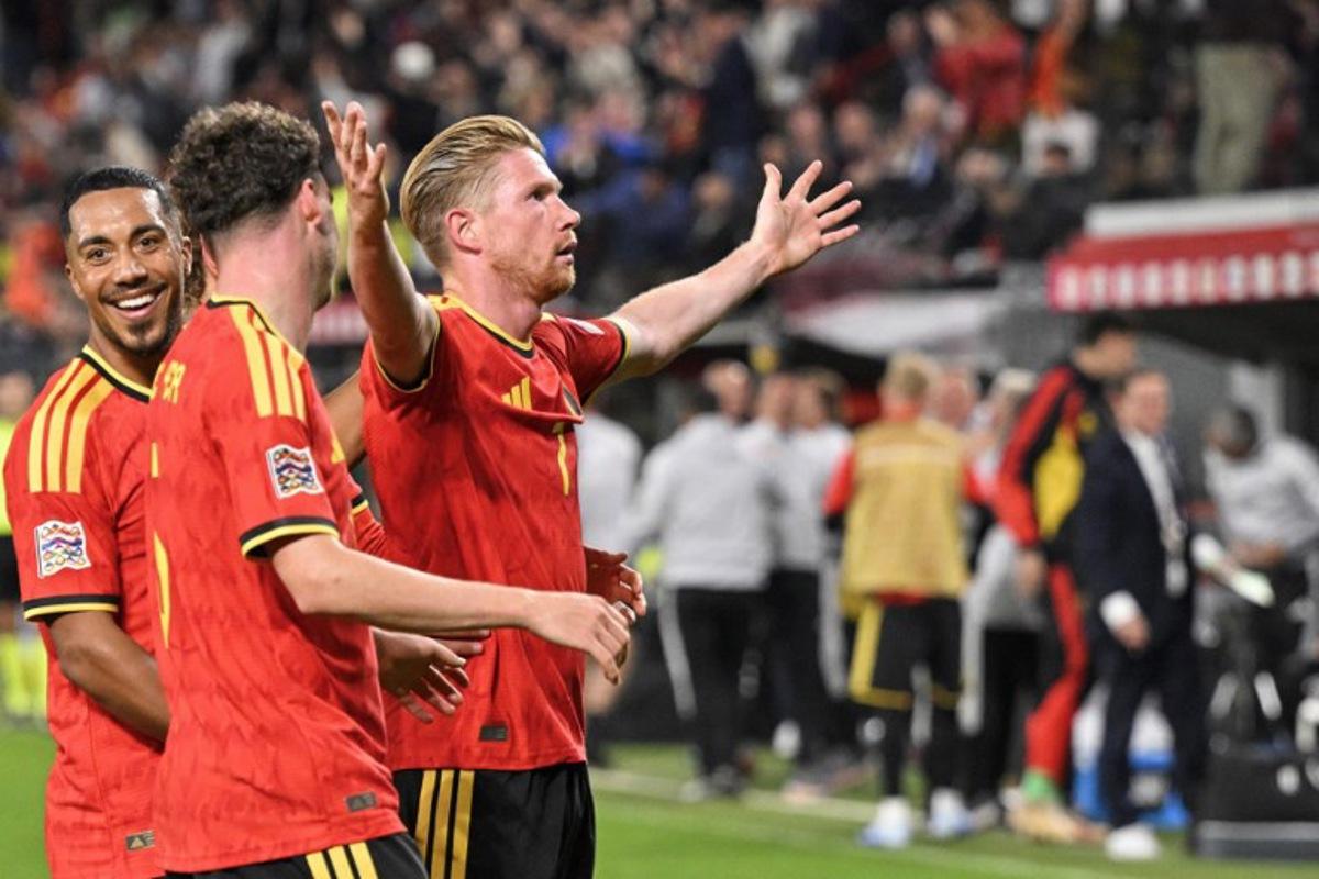 Belgium's midfielder #07 Kevin De Bruyne (R) celebrates with teammates after scoring his team second goal during the UEFA Nations League, League A - Group 1, football match between Belgium and Turkey at the Maurice Dufrasne stadium, in Liege, eastern Belgium on October 2, 2026. JOHN THYS / AFP