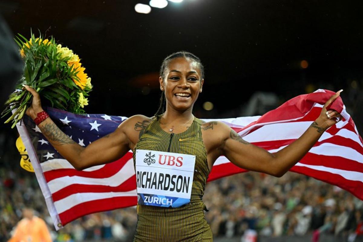 US' Sha'Carri Richardson celebrates after winning the Women's 100m final during the Diamond League athletics meeting at the Letzigrund stadium in Zurich on September 5, 2024. Fabrice COFFRINI / AFP