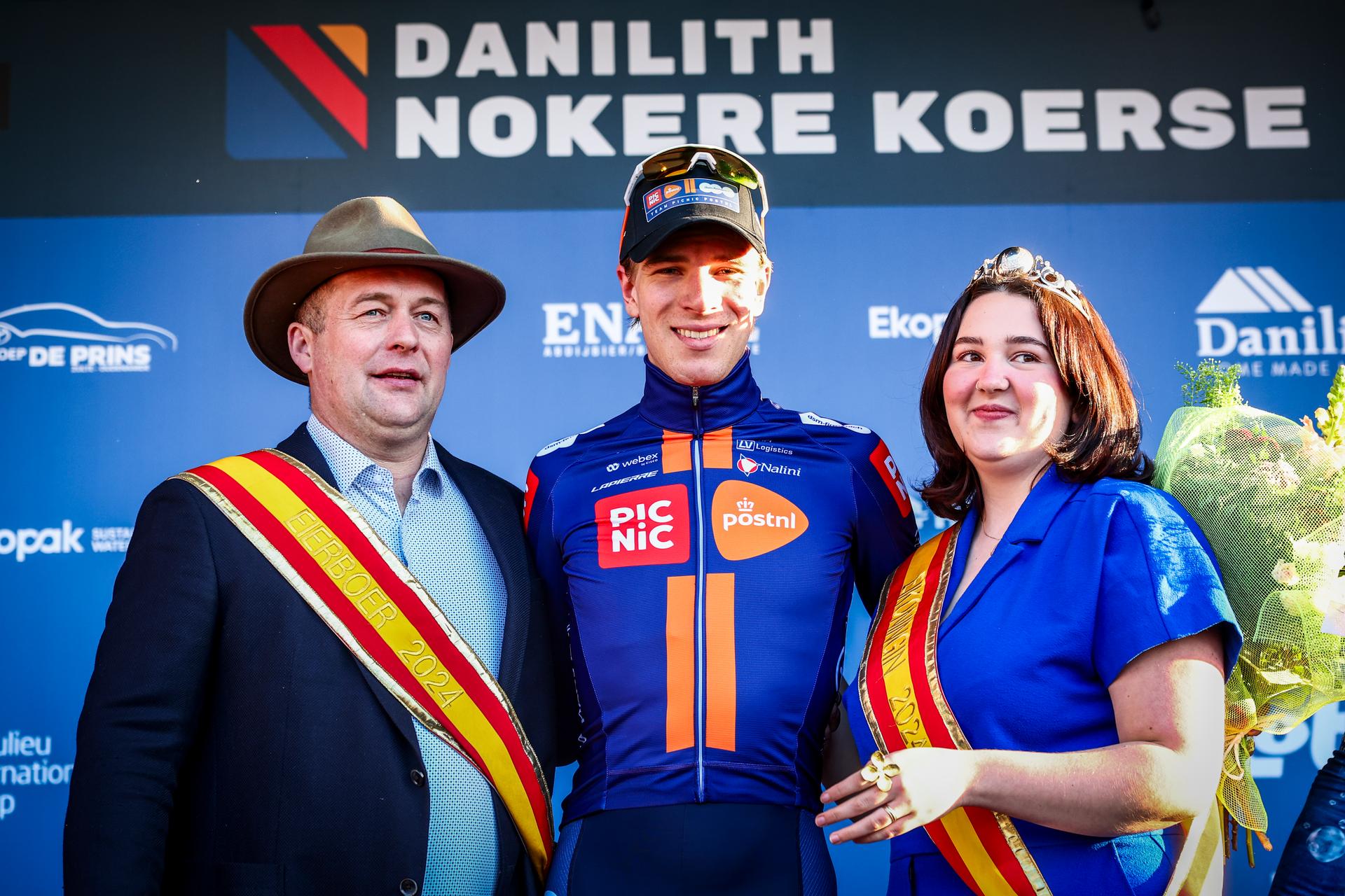 Dutch Nils Eekhoff of Team Picnic PostNL celebrates on the podium after winning the 'Nokere Koerse' one day cycling race for men elite, 188.1 km from Deinze to Nokere, on Wednesday 19 March 2025. BELGA PHOTO DAVID PINTENS