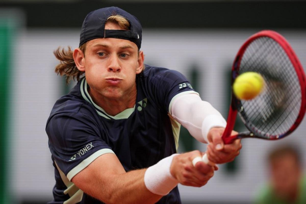 Belgium's Zizou Bergs plays a forehand return to France's Giovanni Mpetshi Perricard during their men's singles match on day 1 of the French Open tennis tournament on Court Suzanne-Lenglen at the Roland-Garros Complex in Paris on May 25, 2025. Dimitar DILKOFF / AFP