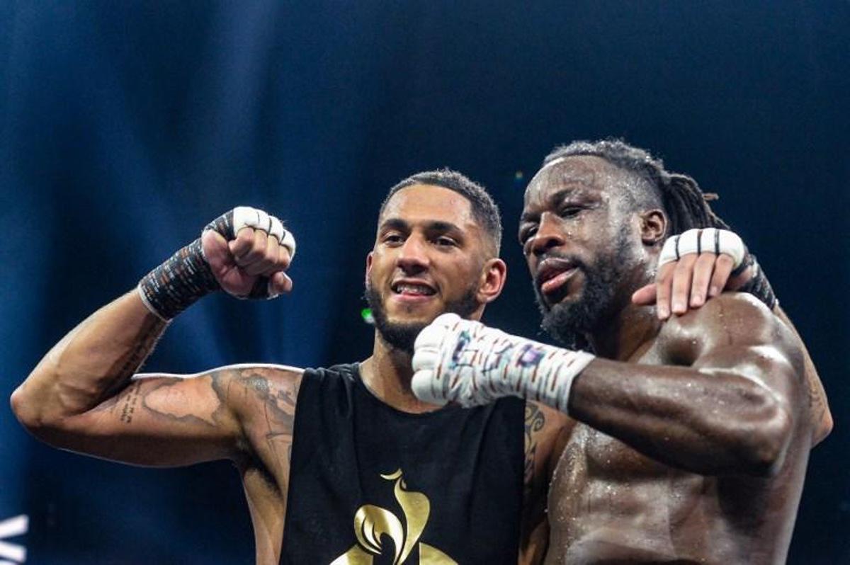 France's Tony Yoka (L) poses with Belgium's Joel Tambwe Djeko after winning their EBU European Union heavyweight title boxing match at the H Arena in Nantes, western France, on March 5, 2021. JEAN-FRANCOIS MONIER / AFP