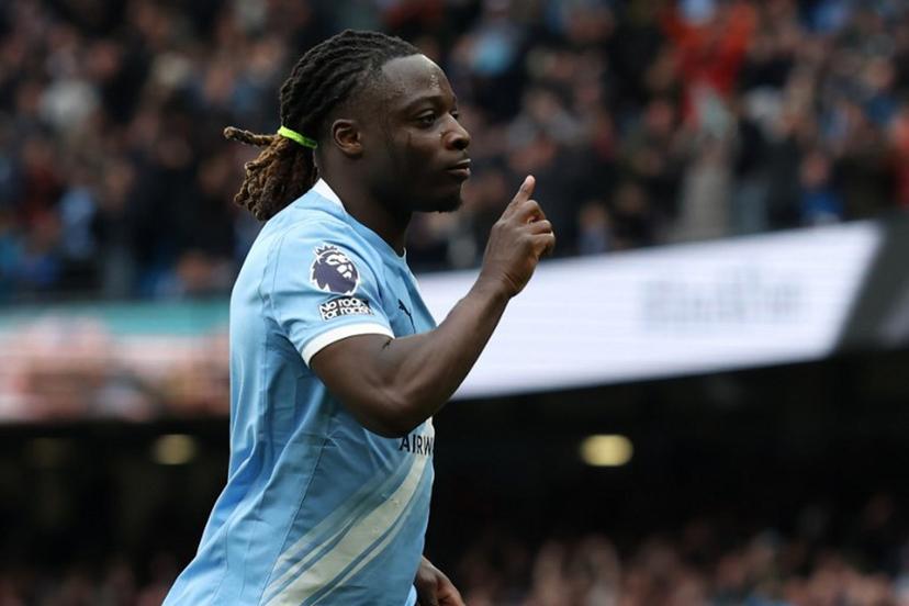 Manchester City's Belgian midfielder #11 Jeremy Doku celebrates after scoring the opening goal during the English Premier League football match between Manchester City and Brentford at the Etihad Stadium in Manchester, north west England, on May 9, 2026. Darren Staples / AFP