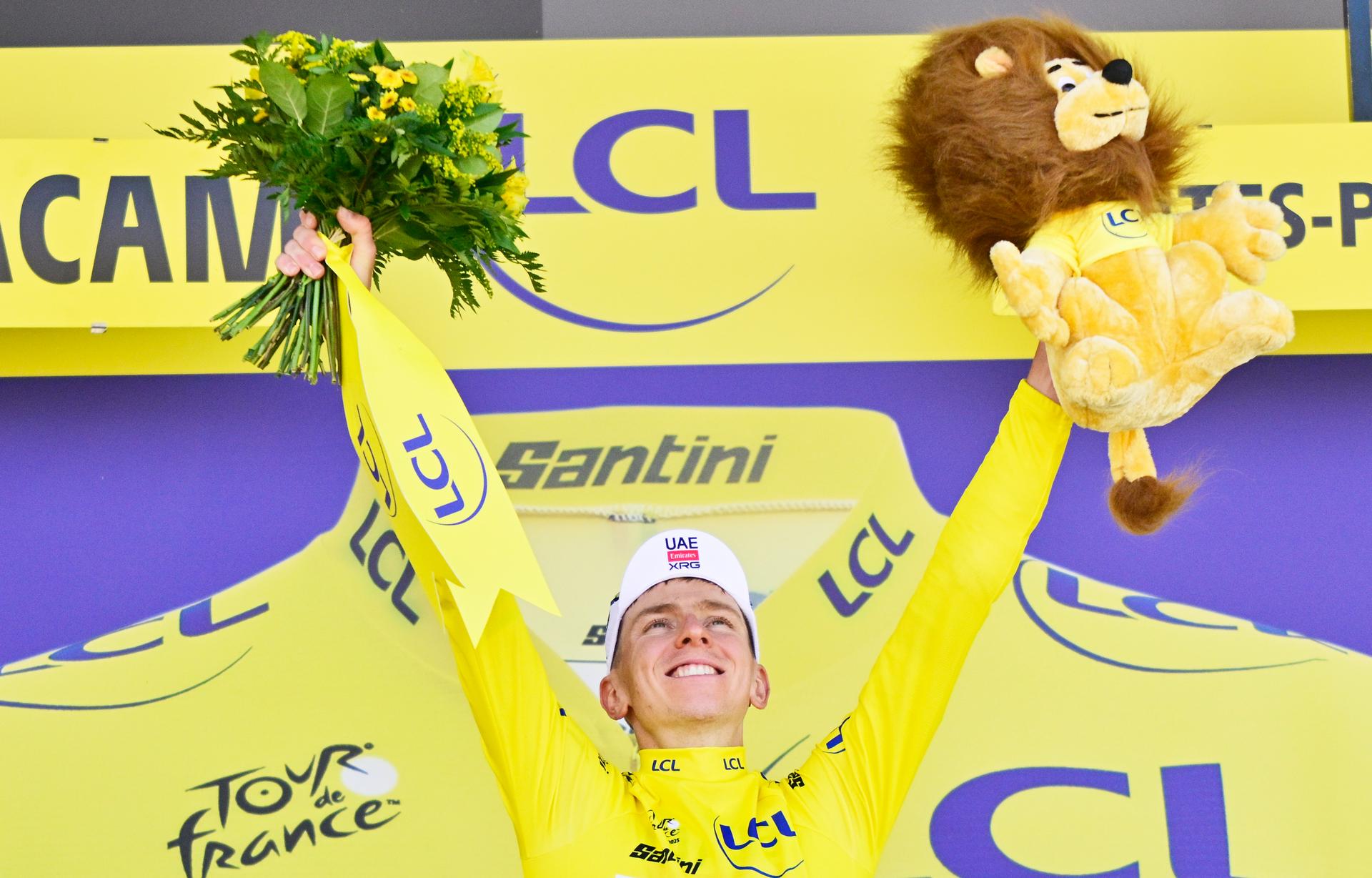 Slovenian Tadej Pogacar of UAE Team Emirates celebrates on the podium in the yellow jersey of leader in the overall ranking after stage 12 of the 2025 Tour de France cycling, from Auch to Hautacam (181 km), on Thursday 17 July 2025 in France. The 112th edition of the Tour de France starts on Saturday 5 July in Lille, France, and will finish in Paris, France on the 27th of July. BELGA PHOTO DIRK WAEM
