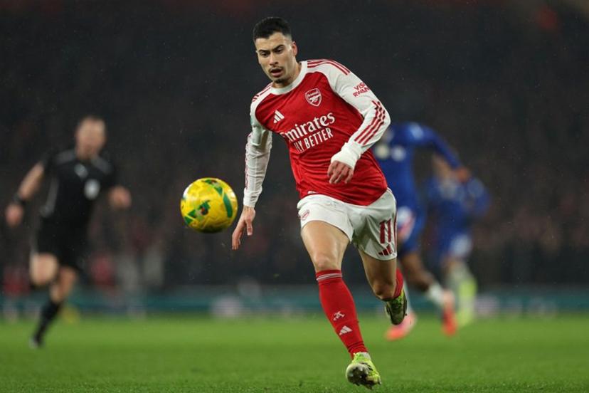 Arsenal's Brazilian midfielder #11 Gabriel Martinelli runs with the ball during the English League Cup semi final second leg, football match between Arsenal and Chelsea at the Emirates Stadium, in London on February 3, 2026. Adrian Dennis / AFP