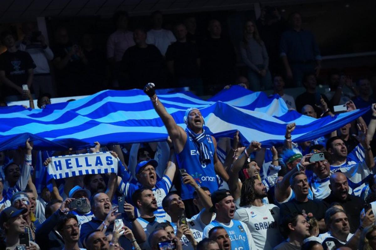 Greece's fans cheer for their team prior to the start of the FIBA EuroBasket 2025 semi-final basketball match between Greece and Turkey in Riga, Latvia, on September 12, 2025. Gints Ivuskans / AFP