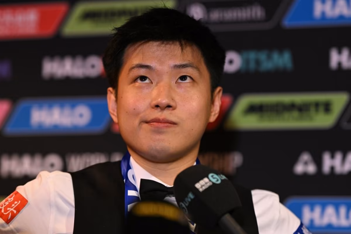 China's Zhao Xintong reacts at a press conference after victory over Wales' Mark Williams in the World Championship Snooker final at The Crucible in Sheffield, northern England on May 5, 2025. Zhao Xintong became the first Chinese player to win the World Snooker Championship as the qualifier completed his stunning march to the title with a 18-12 victory against Mark Williams in the final on Monday. Oli SCARFF / AFP