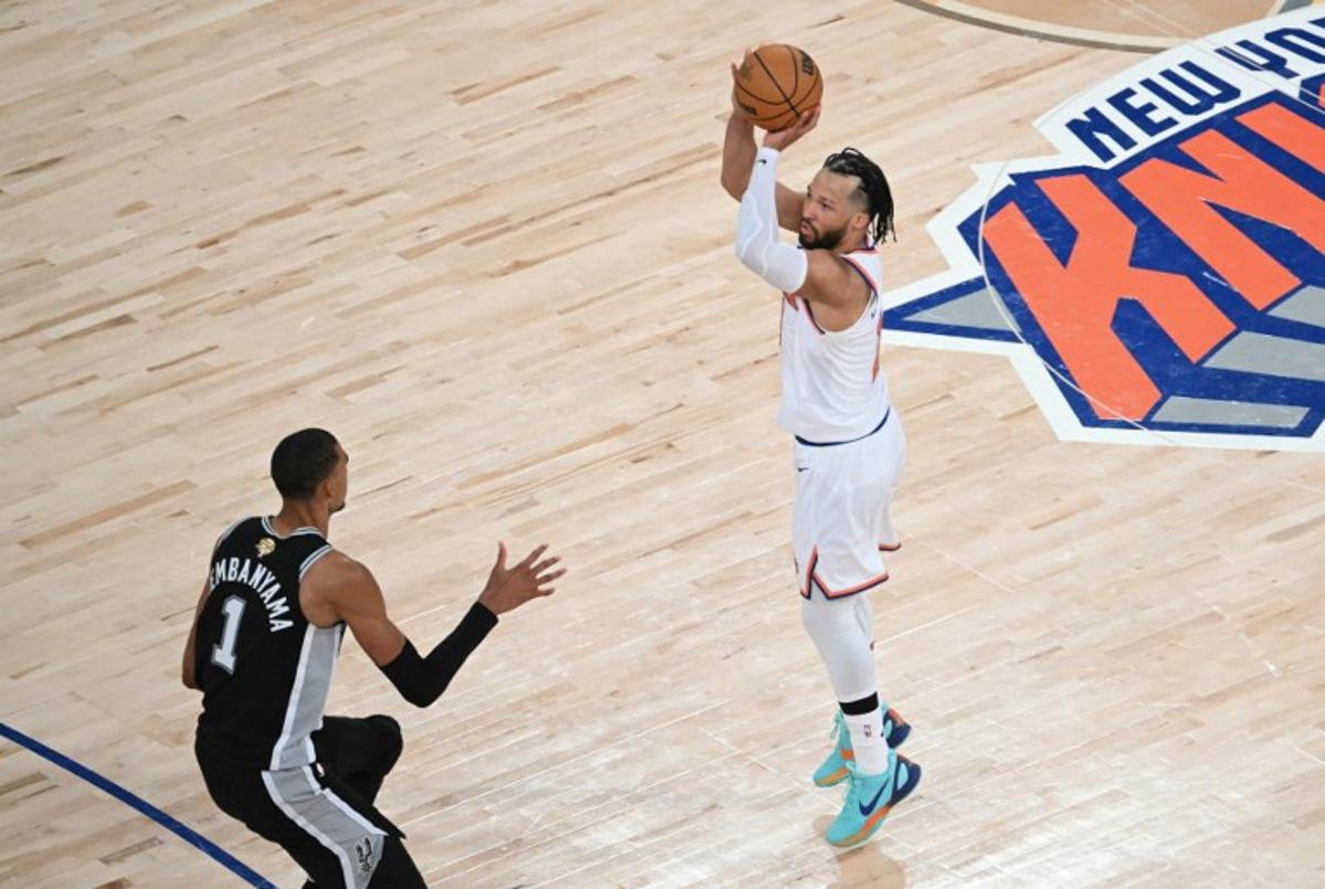 San Antonio Spurs' French forward-center #01 Victor Wembanyama looks on as Knicks guard #11 Jalen Brunson takes a shot on basket during Game Three of the NBA Finals between the San Antonio Spurs and the New York Knicks at Madison Square Garden in New York on June 8, 2026. SAUL LOEB / AFP