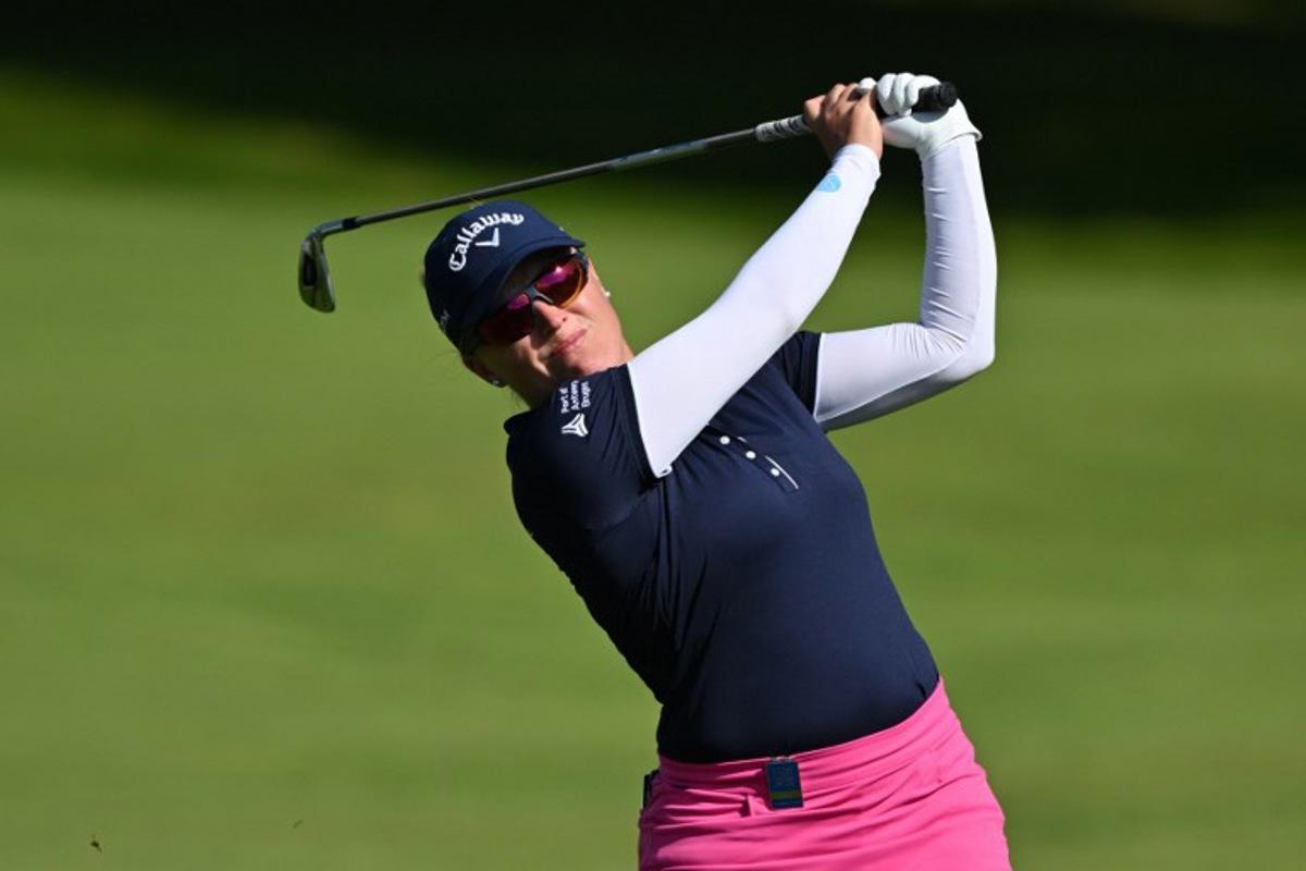 Belgium's Manon de Roey watches her approach shot from the 1st fairway on the opening day of the 2023 Women's British Open Golf Championship at Walton Heath Golf Club in Walton-on-the-Hill, south-west of London on August 10, 2023. Glyn KIRK / AFP