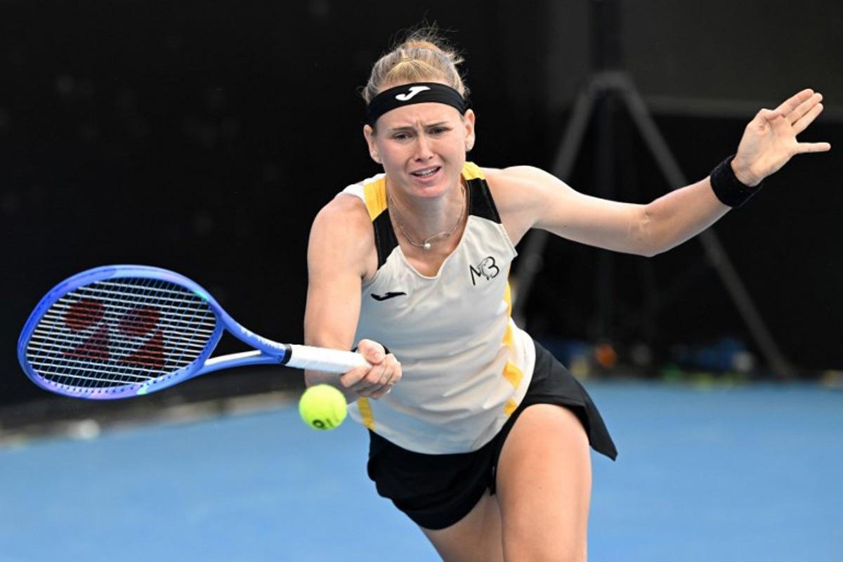 Marie Bouzkova of the Czech Republic hits a return during her women's singles match against Paula Badosa of Spain during the 2026 Adelaide International Tennis Tournament at Memorial Drive Tennis Club in Adelaide on January 12, 2026. Michael ERREY / AFP
