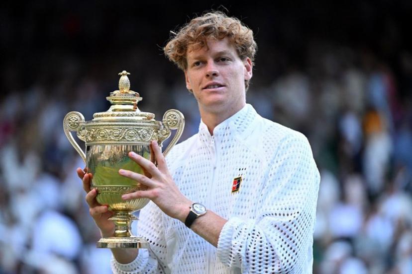 Italy's Jannik Sinner poses with his trophy after beating Germany's Alexander Zverev during their men's singles final tennis match on the fourteenth day of the 2026 Wimbledon Championships at The All England Lawn Tennis and Croquet Club in Wimbledon, southwest London, on July 12, 2026. Kirill KUDRYAVTSEV / AFP